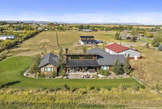 birds eye view of property featuring a mountain view and a rural view