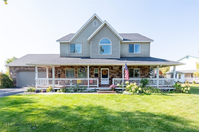 farmhouse inspired home with a porch, a garage, and a front yard