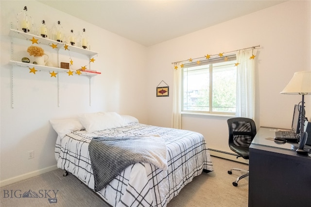 carpeted bedroom featuring baseboard heating