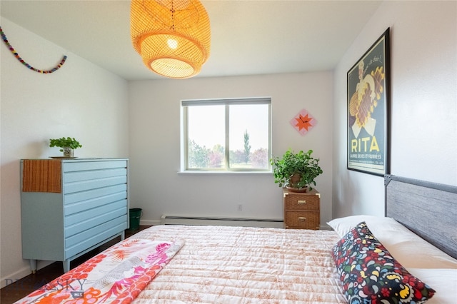 bedroom with a baseboard heating unit