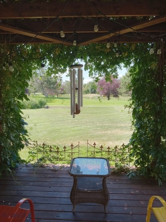 deck with a gazebo and a lawn