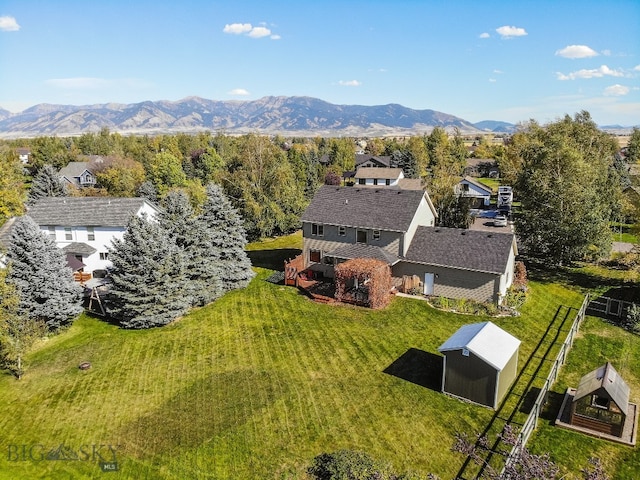 birds eye view of property with a mountain view