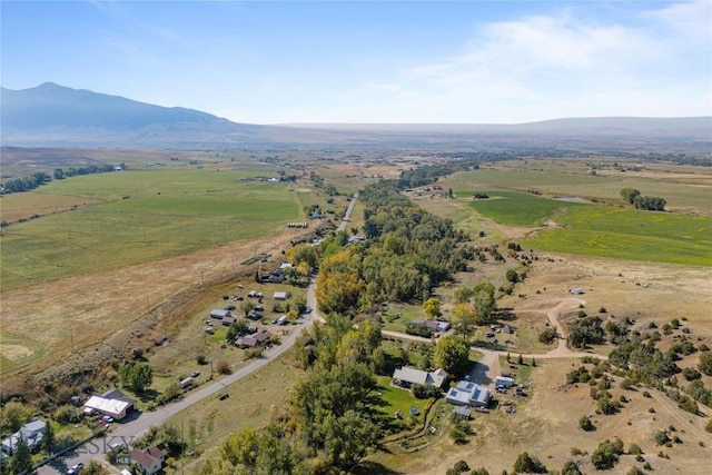 drone / aerial view featuring a rural view and a mountain view