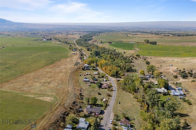 birds eye view of property with a rural view