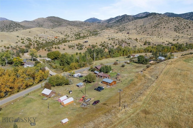 aerial view with a mountain view and a rural view