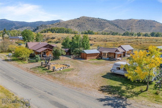 drone / aerial view featuring a rural view and a mountain view