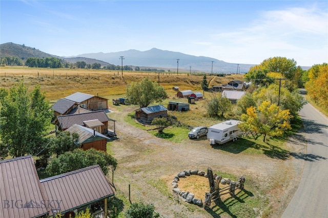 birds eye view of property featuring a rural view and a mountain view