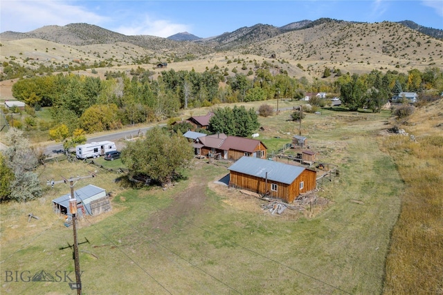 birds eye view of property featuring a mountain view