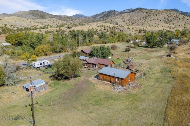 drone / aerial view featuring a mountain view and a rural view