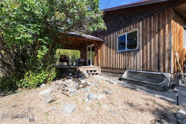 view of side of home featuring a gazebo
