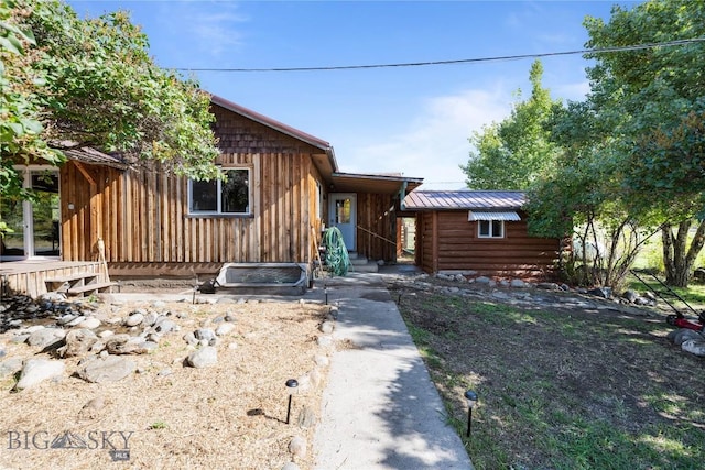 view of front of home featuring metal roof