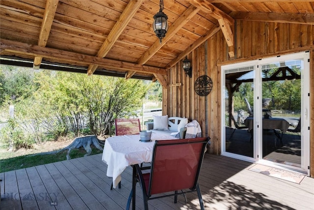 wooden deck with outdoor dining space