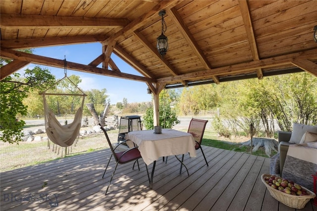 wooden deck featuring outdoor dining area