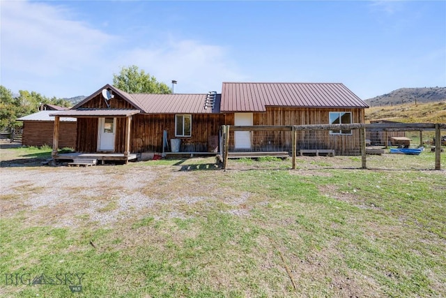 view of front of property with metal roof and board and batten siding