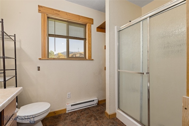 bathroom with an enclosed shower, baseboard heating, tile patterned floors, vanity, and toilet