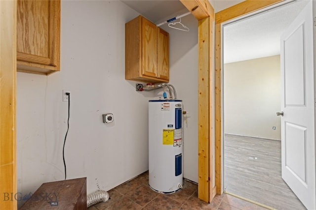 utility room featuring electric water heater