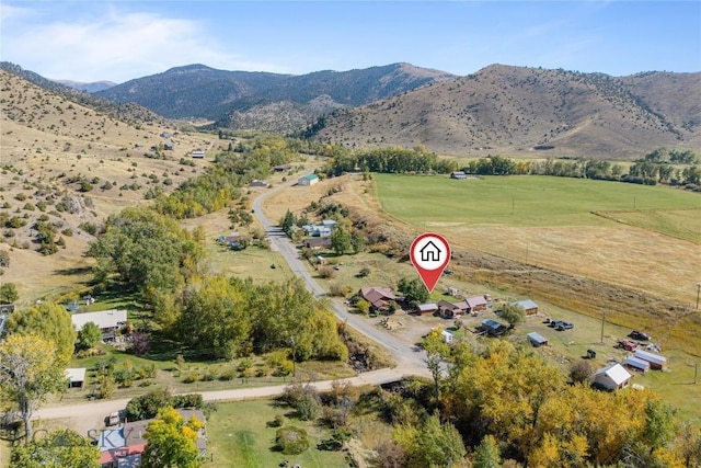 birds eye view of property with a rural view and a mountain view