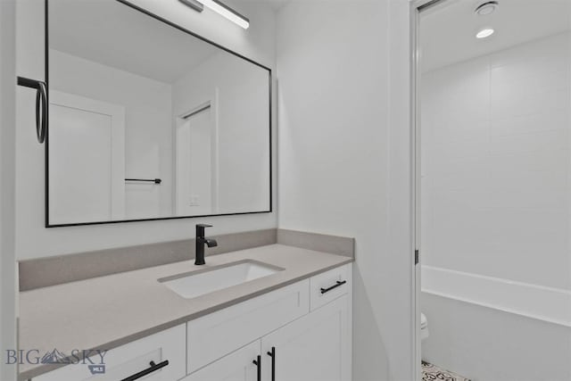 full bathroom featuring vanity, toilet, and tub / shower combination