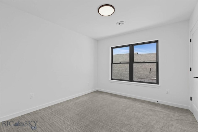 unfurnished room with light colored carpet