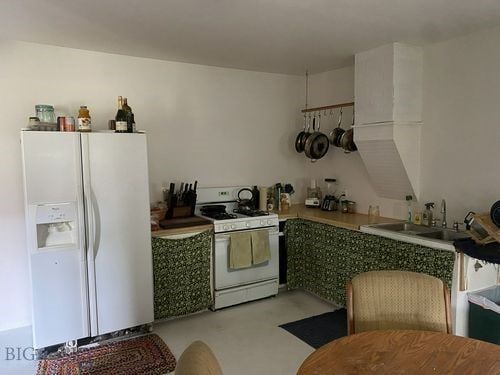 kitchen with sink and white appliances