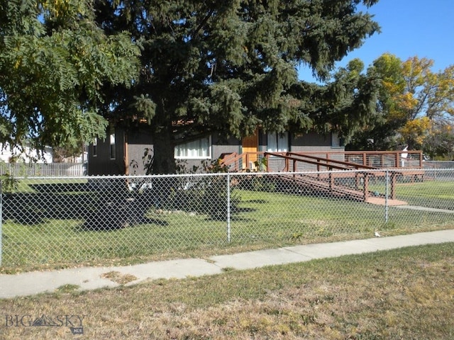 obstructed view of property featuring a front lawn