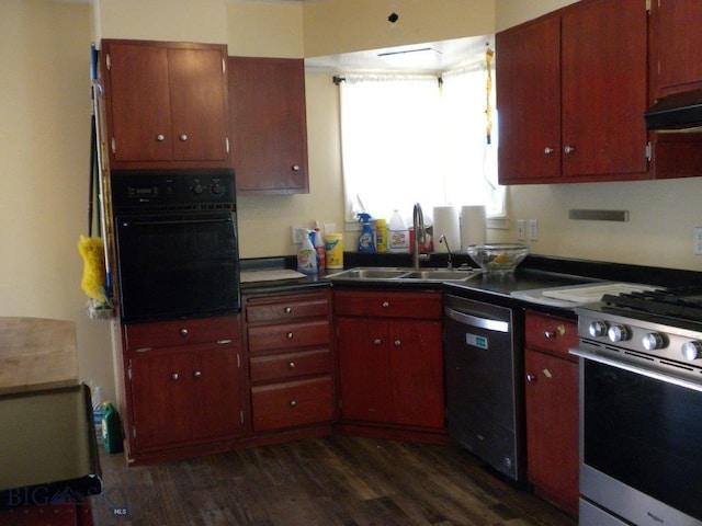 kitchen featuring ventilation hood, sink, stainless steel appliances, and dark hardwood / wood-style flooring