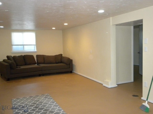 living room featuring a textured ceiling