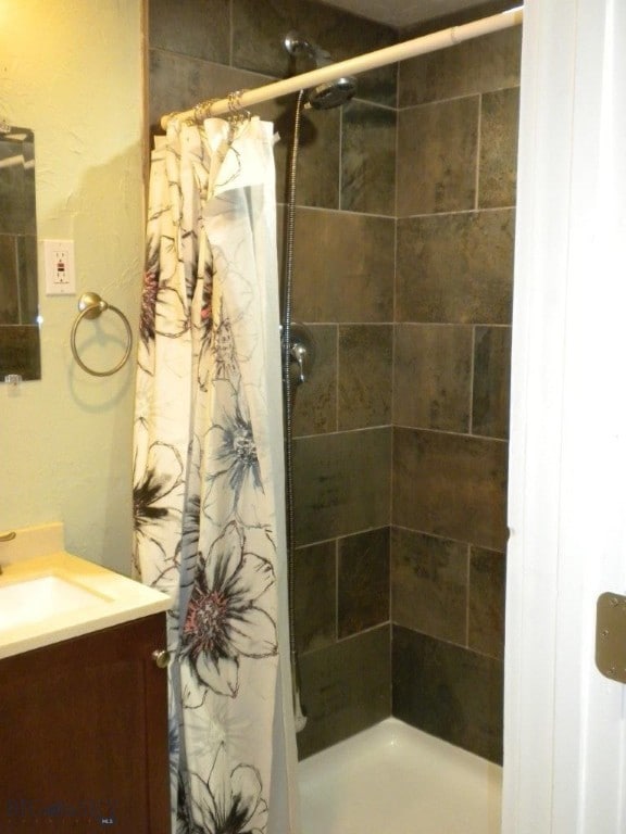 bathroom featuring vanity and a shower with curtain