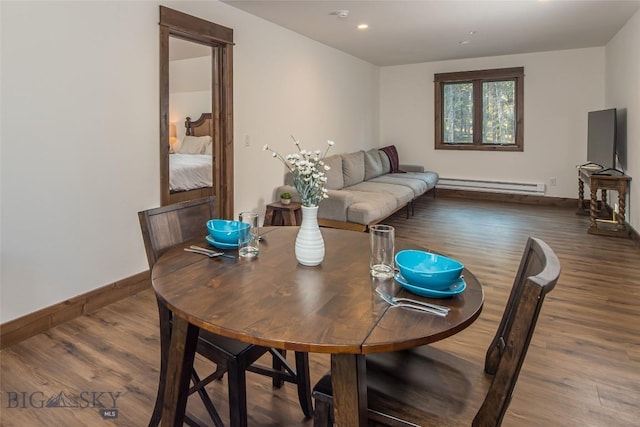 2250 Outlook Trl, Big Sky, MT 59716 - dining space with baseboard heating, wood finished floors, and recessed lighting