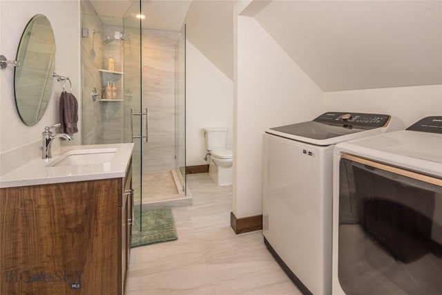 2250 Outlook Trl, Big Sky, MT 59716 - laundry area with washing machine and dryer and light marble finish flooring