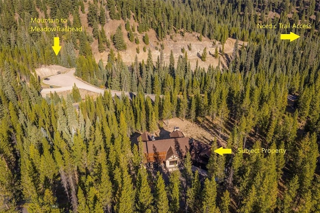 2250 Outlook Trl, Big Sky, MT 59716 - aerial view of property and surrounding area featuring a heavily wooded area