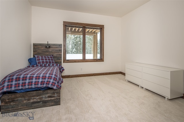 bedroom featuring light carpet