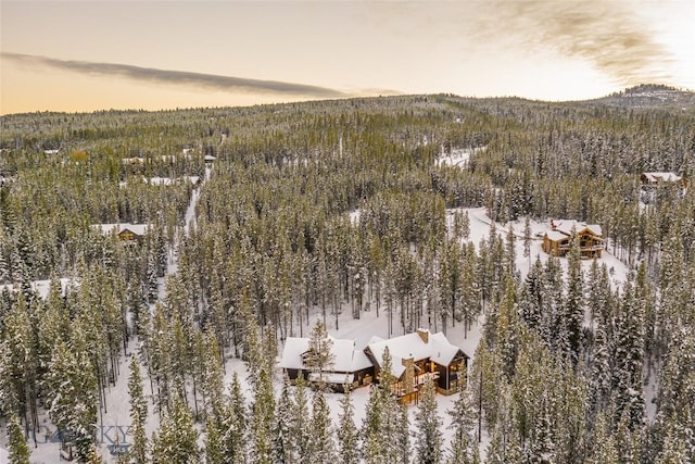 2250 Outlook Trl, Big Sky, MT 59716 - snowy aerial view featuring a view of trees and a mountain view