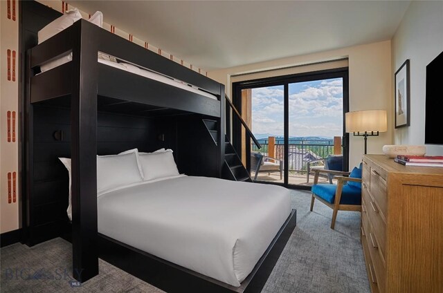 824 Settlement Trl Unit 6A, Big Sky, MT 59716 - bedroom with carpet floors and access to outside