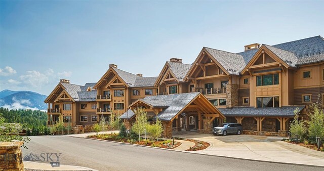 824 Settlement Trl Unit 6A, Big Sky, MT 59716 - view of building exterior with a mountain view and driveway