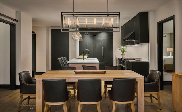 dining room featuring an inviting chandelier and dark wood-type flooring