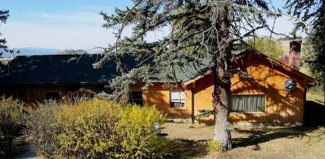 view of home's exterior with a mountain view