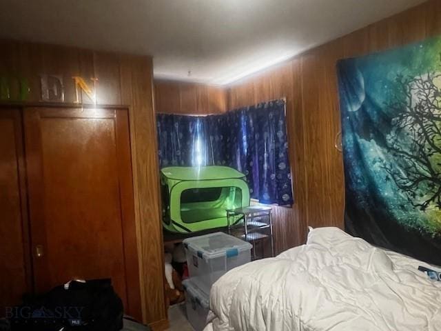 bedroom with wooden walls