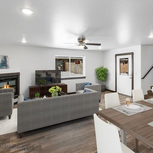 living room with dark hardwood / wood-style floors and ceiling fan