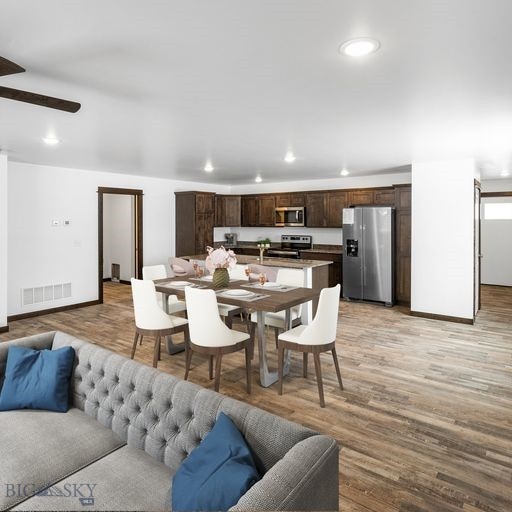 dining area featuring ceiling fan and light hardwood / wood-style floors