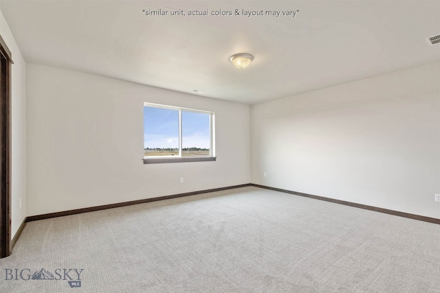 unfurnished room featuring carpet floors