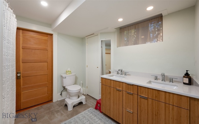 bathroom with vanity and toilet