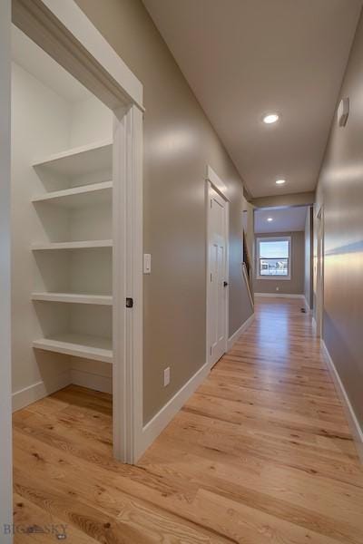 hallway with light wood-type flooring