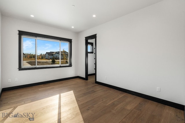 119 Clancy Way, Bozeman, MT 59718 - spare room featuring wood finished floors, recessed lighting, and baseboards
