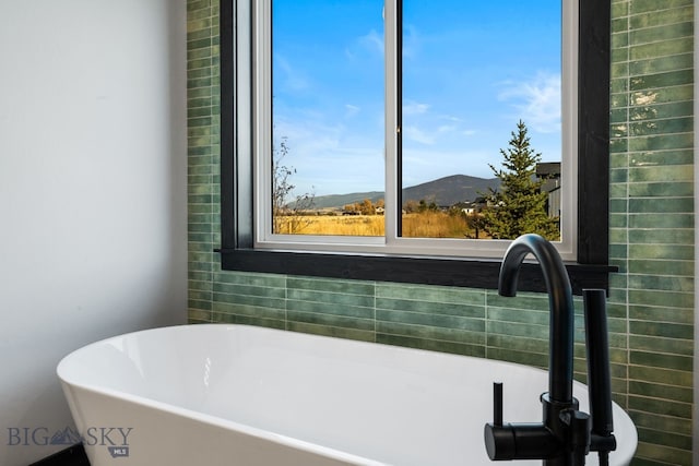 119 Clancy Way, Bozeman, MT 59718 - full bathroom with a freestanding tub, a sink, and a mountain view