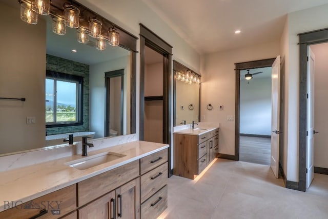 119 Clancy Way, Bozeman, MT 59718 - full bathroom with two vanities, tile patterned flooring, baseboards, and recessed lighting