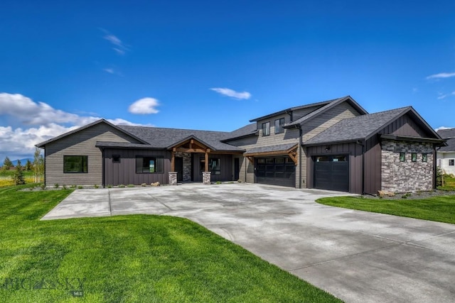 119 Clancy Way, Bozeman, MT 59718 - view of front of house featuring board and batten siding, a front lawn, stone siding, and driveway