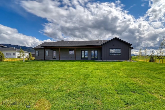 119 Clancy Way, Bozeman, MT 59718 - rear view of house with board and batten siding and a yard