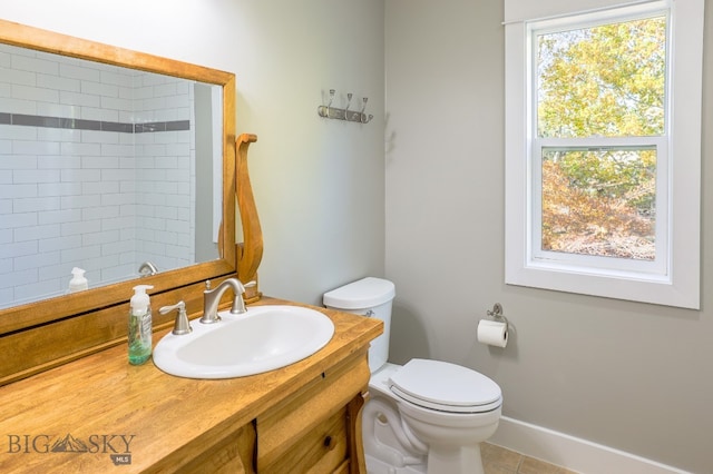 bathroom featuring vanity, toilet, and tile patterned floors