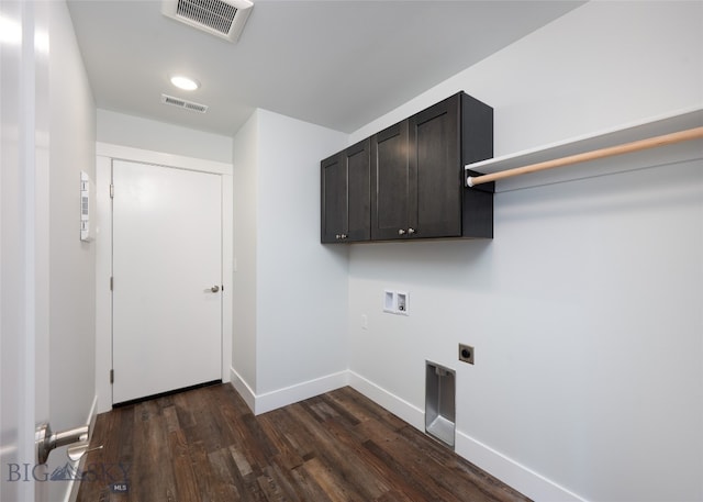 laundry room featuring washer hookup, cabinets, dark wood-type flooring, and hookup for an electric dryer